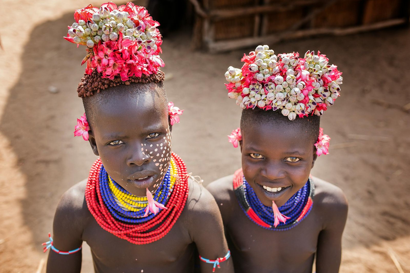Colorful portrait of Ethiopian children in traditional attire in Turmi, Ethiopia.