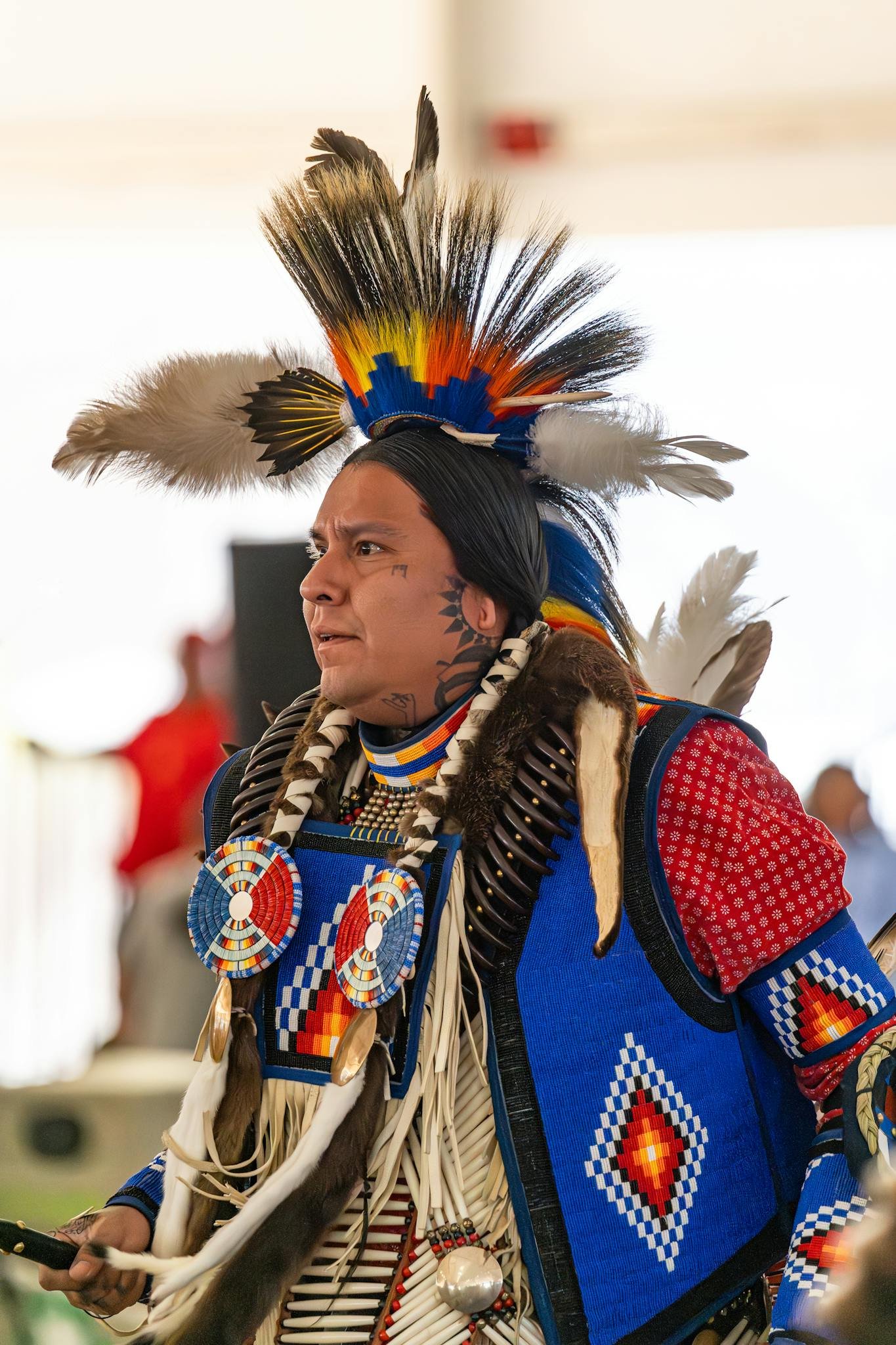 Native American man in traditional regalia during a powwow in Cabazon, CA.